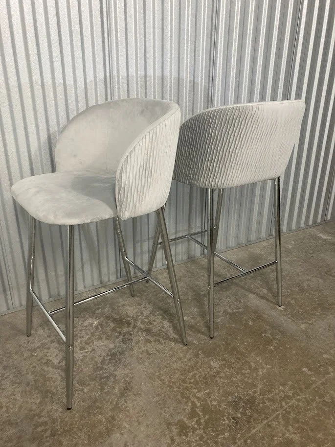 Chrome metal frame and footrest detail on Fran counter stool