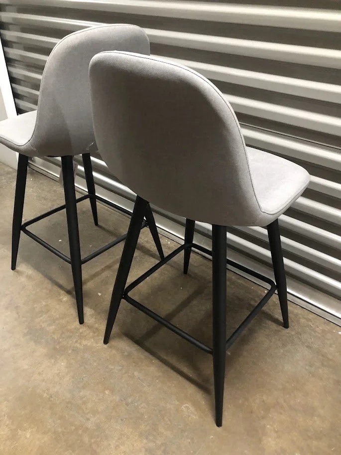 Black metal leg and footrest detail on LumiSource Pebble counter stool