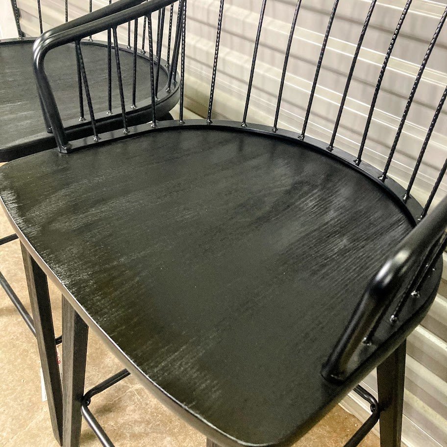 angled view of LumiSource Winston black wood and metal counter stools