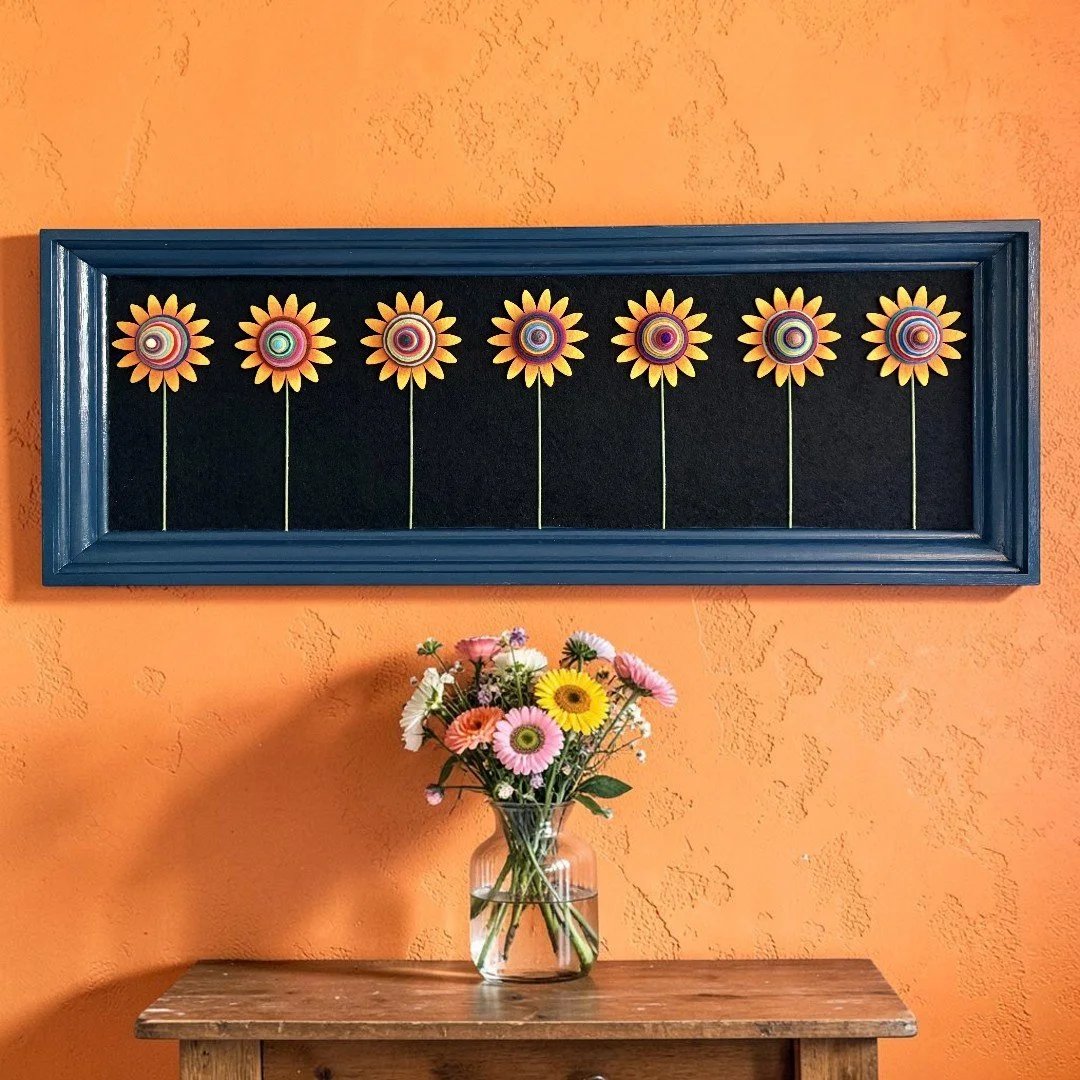 blue_frame_with_7_sunflowers.jpg