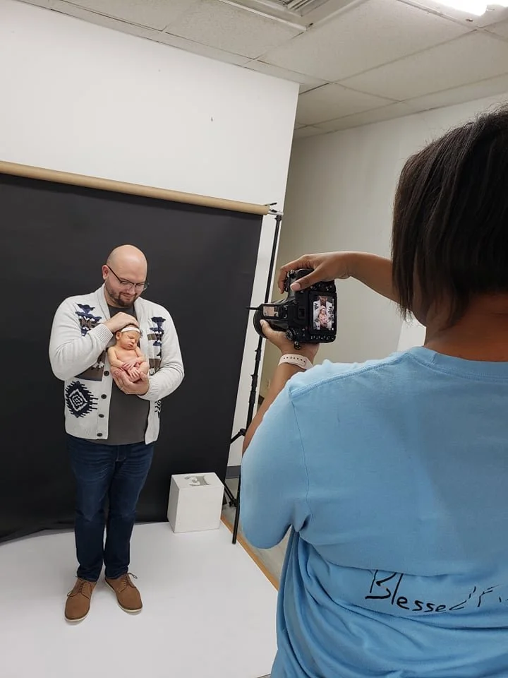 Behind the scenes father and baby girl newborn photography in studio