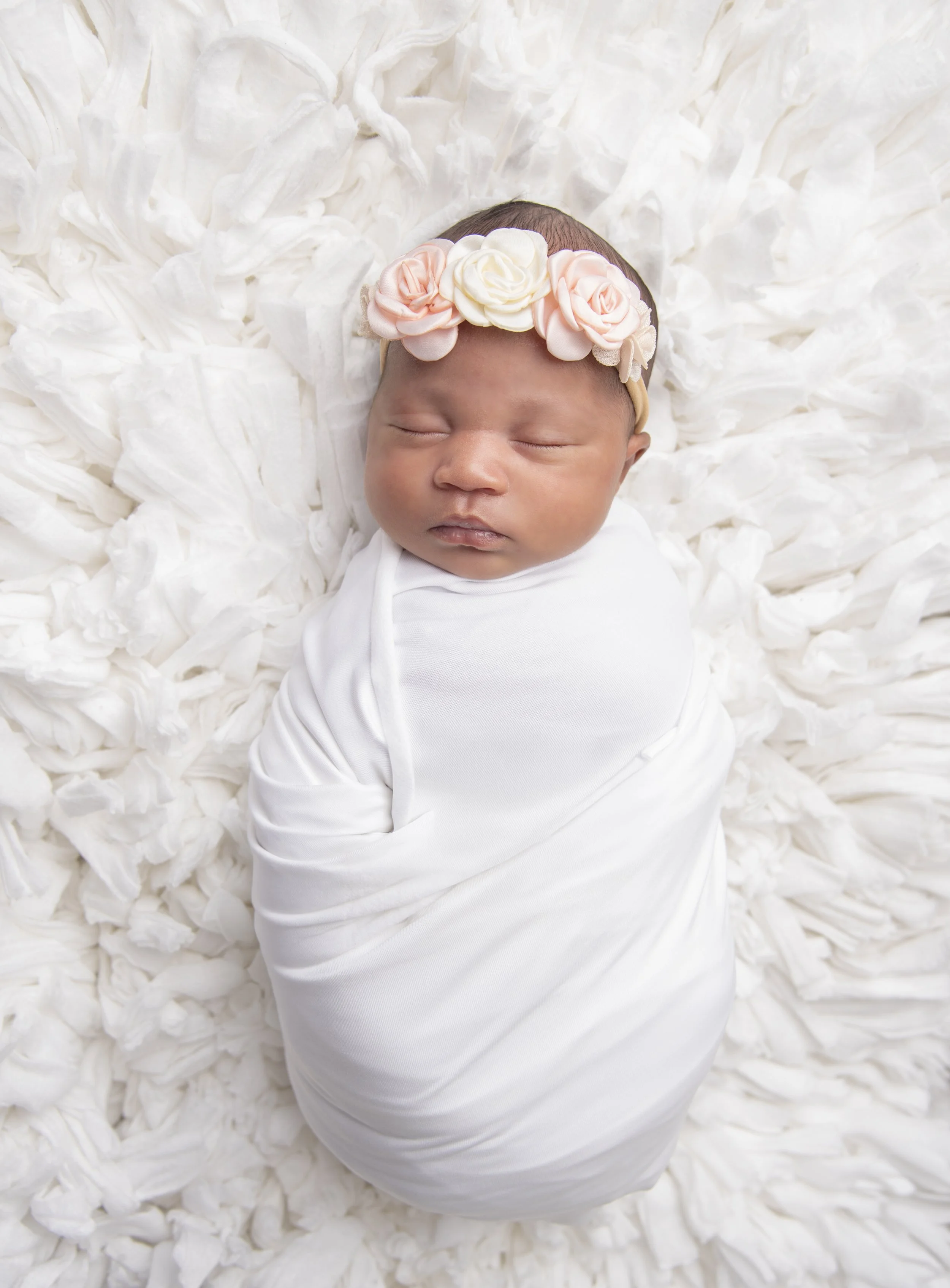 Sleeping newborn baby photographed during a Spring TX newborn photography session