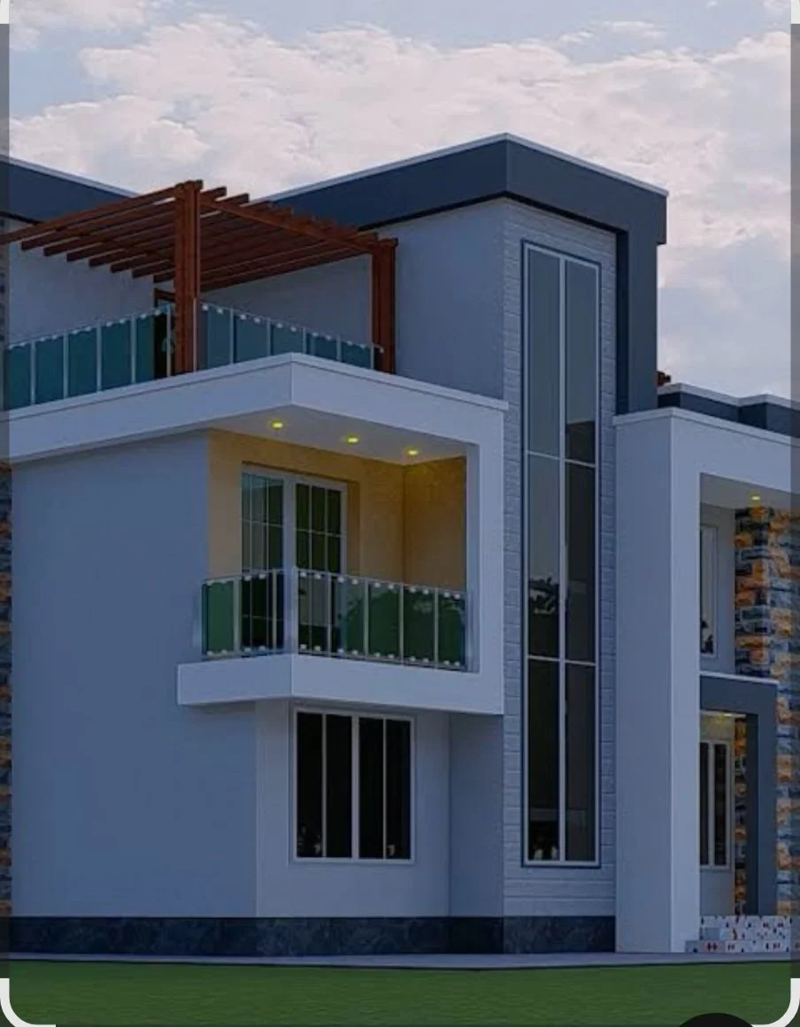 Modern two-story house with large glass windows, a balcony with glass railing, and a wooden pergola on the upper terrace. The house has a mix of white walls, stonework, and sleek design features, with a lawn in front.