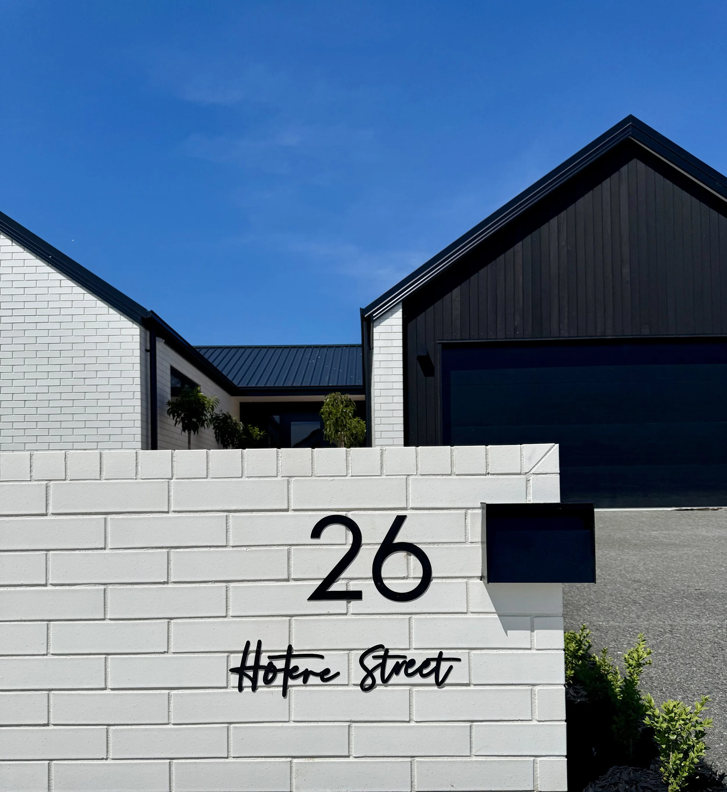White oversized letterbox completed by Nijssen Bricklaying