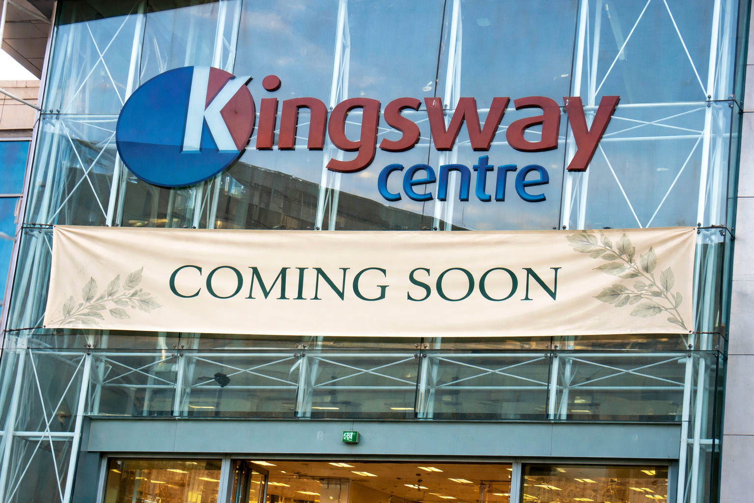 Exterior of Kingsway Centre shopping mall with a sign indicating 'Coming Soon' for a new store or attraction.