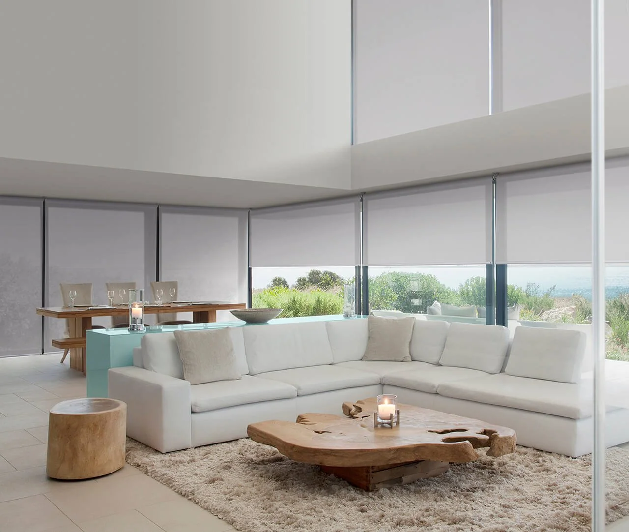 White full length Roller Blinds combined will full length drapes in living space.jpg