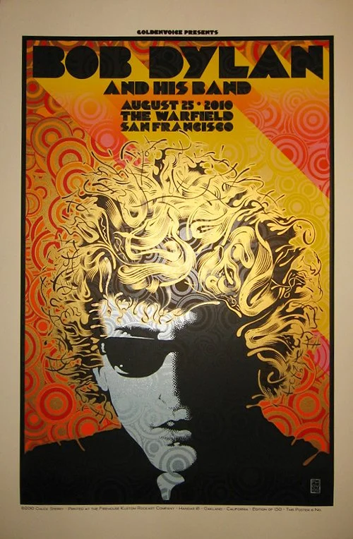 Concert poster for Bob Dylan and his band, featuring a stylized portrait of Bob Dylan with curly hair and sunglasses against an orange and yellow background with swirling pattern.