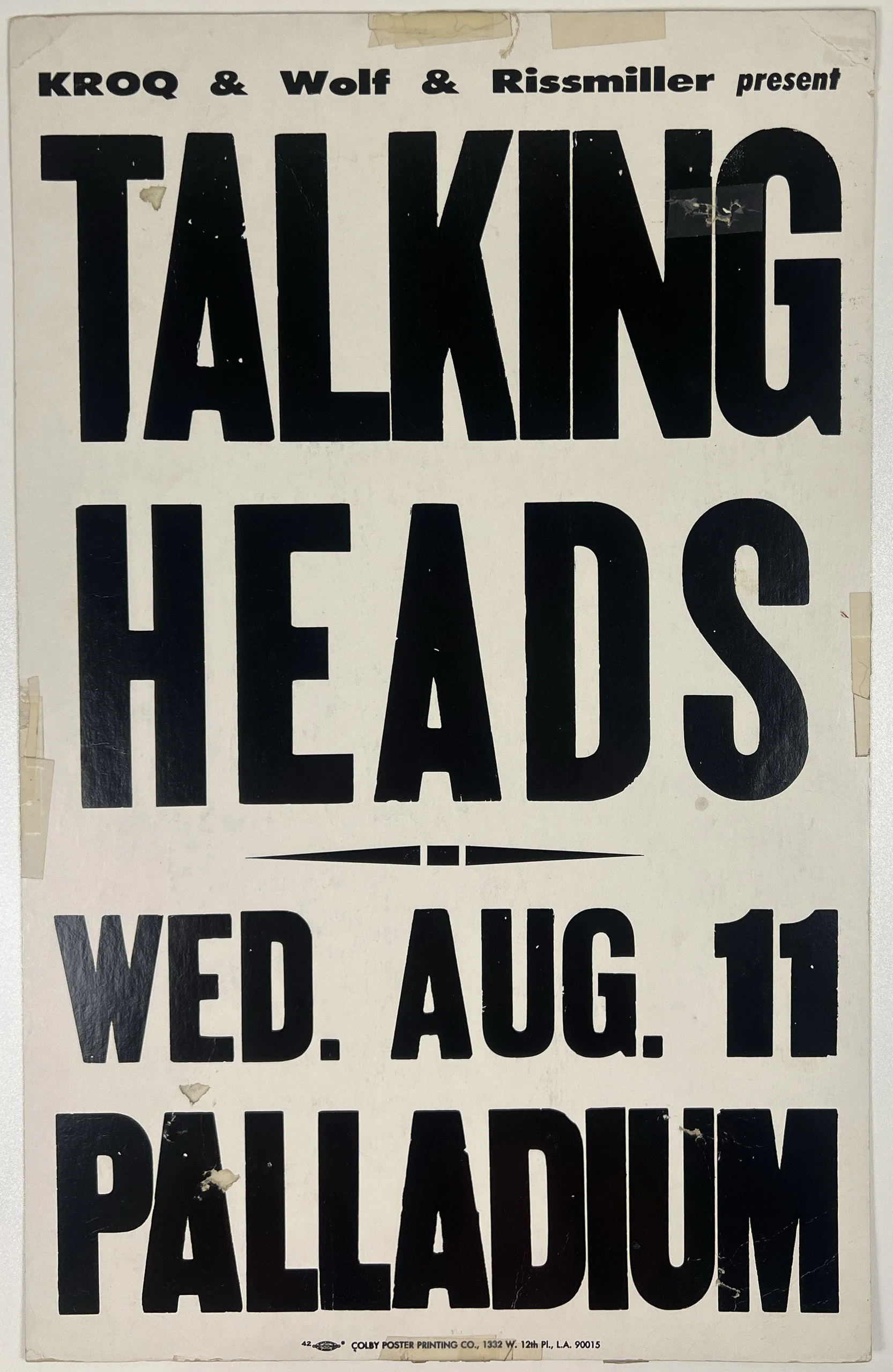 Vintage poster advertising a talk titled 'Talking Heads' presented by KROQ, Wolf, and Rissmiller on Wednesday, August 11 at Paladium.