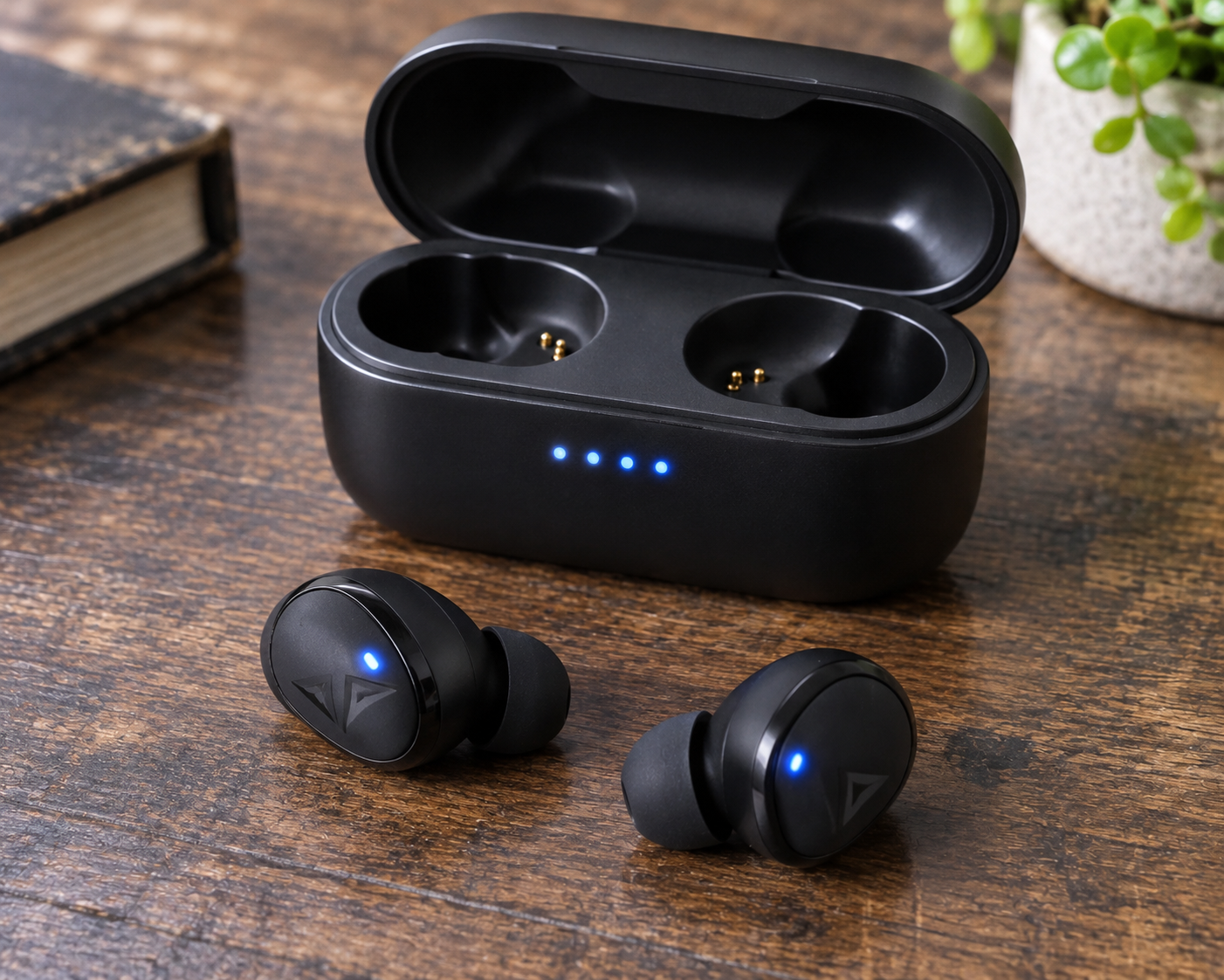Matte Black Wireless Earbuds on Wood.png
