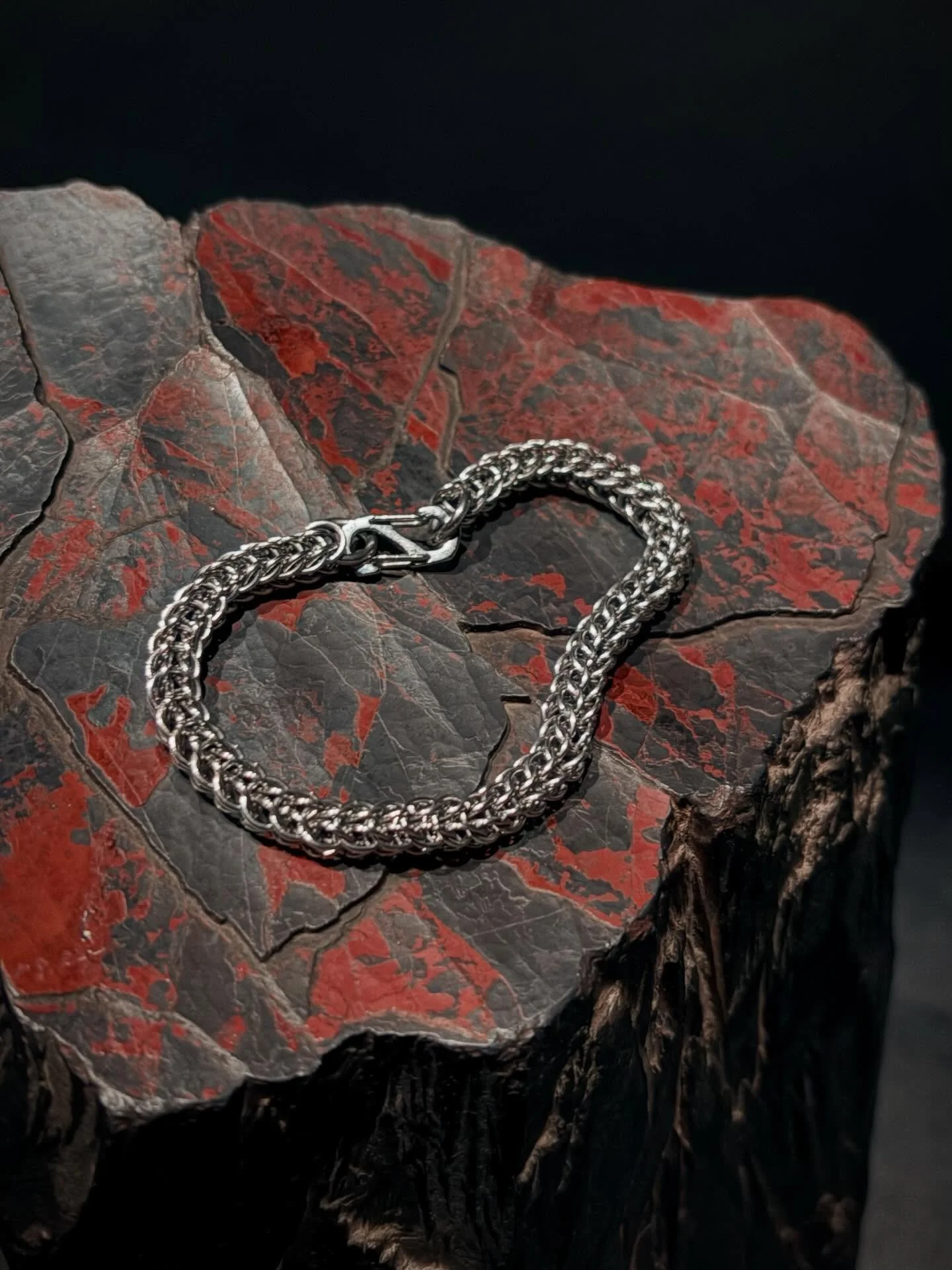 A classic Full Persian bracelet resting on red hematite gracefully embraces the raw and refined elements. Our chainmail is crafted from high-quality stainless steel for durability and shine.
.
#chainmaille #wearablearchitecture #fullpersian #darkaest