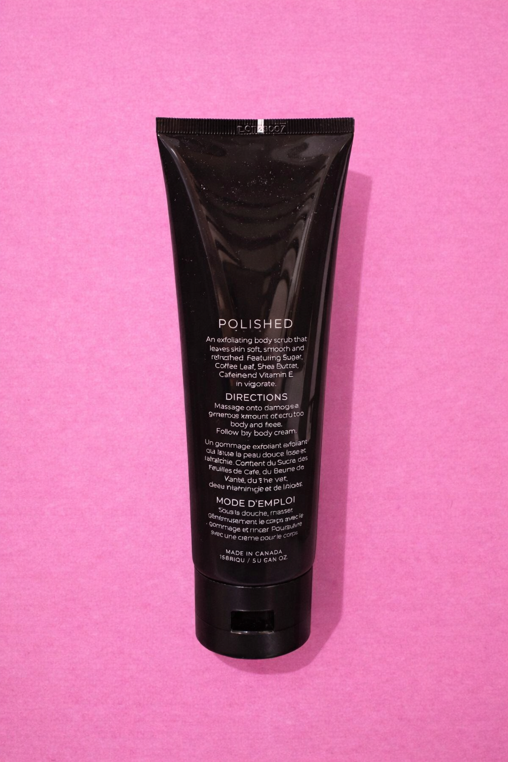 Polished body scrub on pink backdrop.png