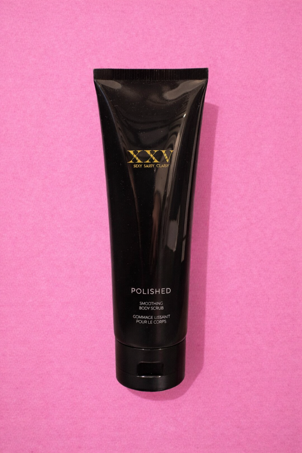 Polished body scrub against pink backdrop.png