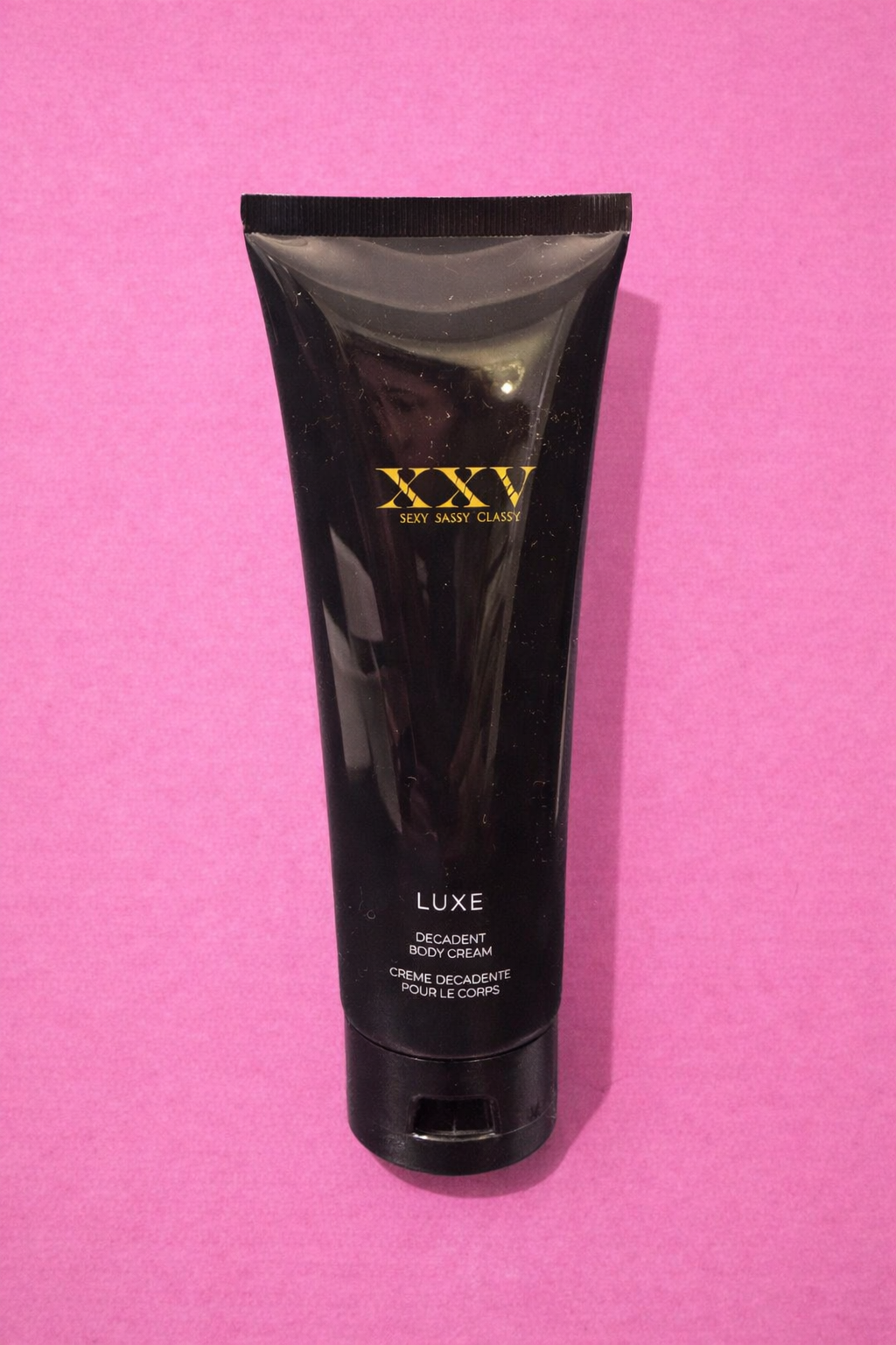 Decadent body cream with gold logo.png