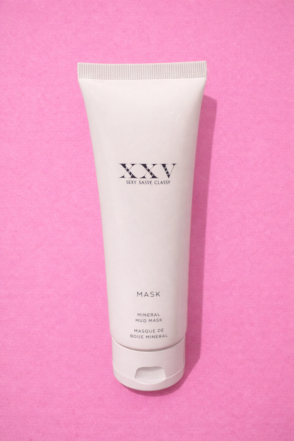 Mineral mud mask on pink backdrop.png