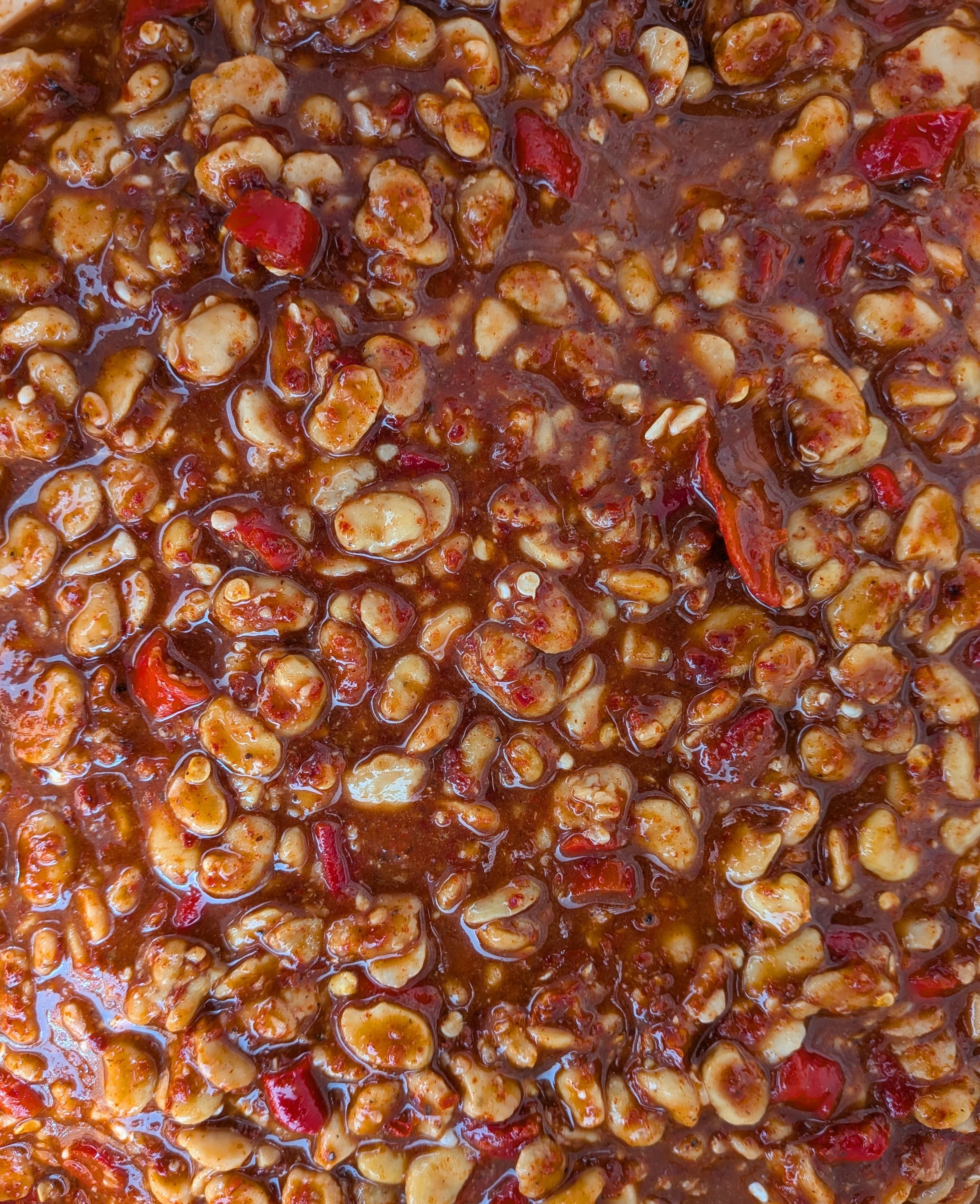 A rich sauce of chilli and broad beans.