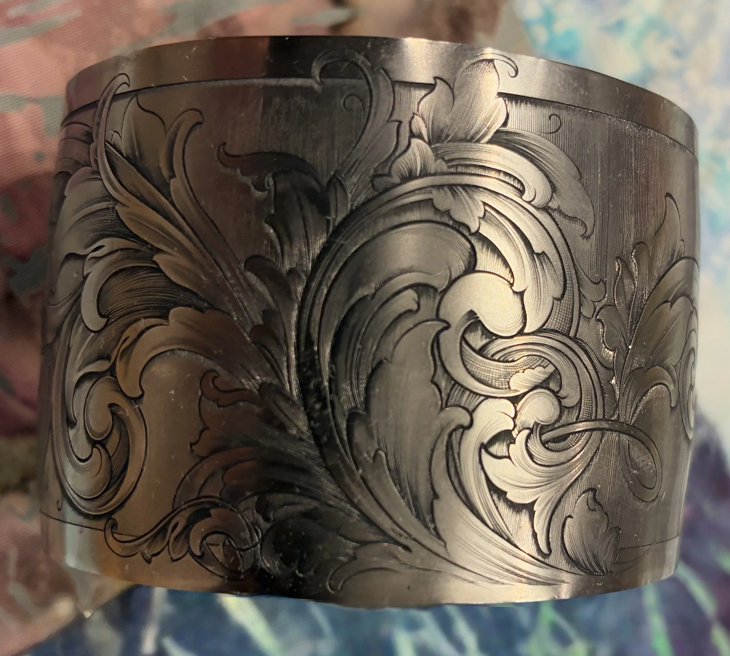 Hand-engraved titanium cuff with American scrolls.