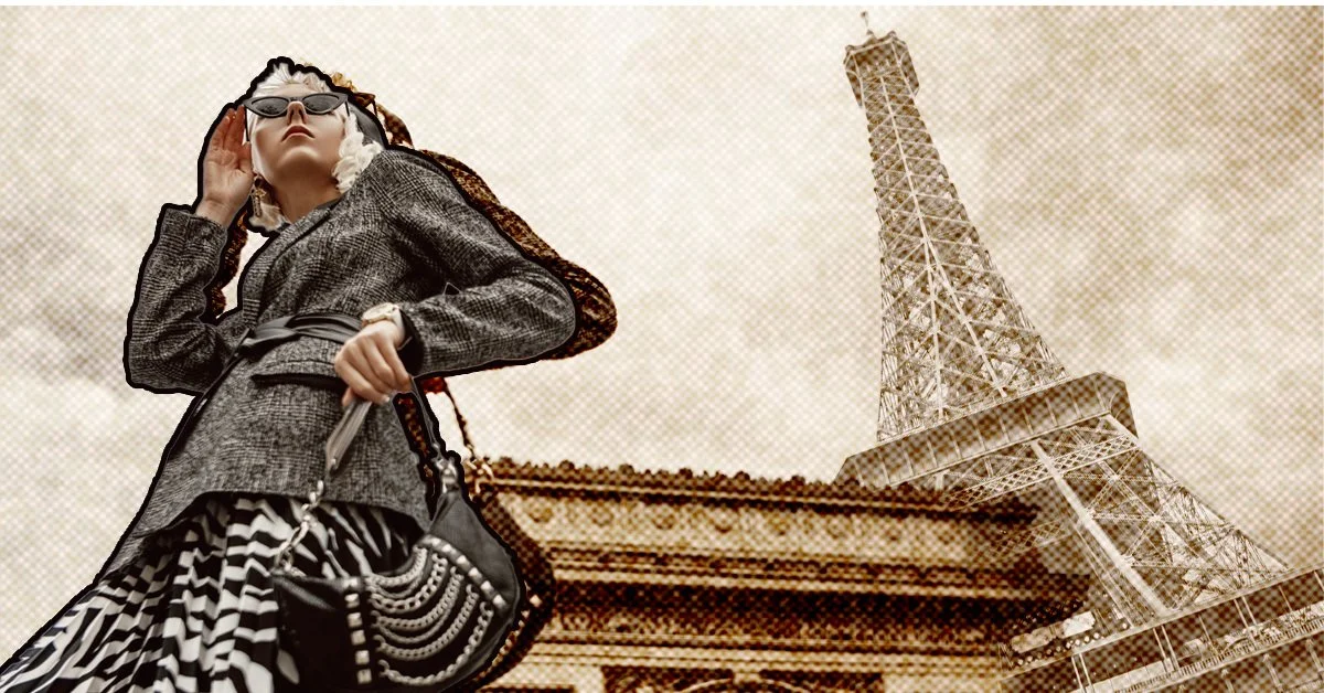 A fashionable woman wearing sunglasses, a blazer, and a patterned skirt, standing in front of the Eiffel Tower and a pagoda-style building.
