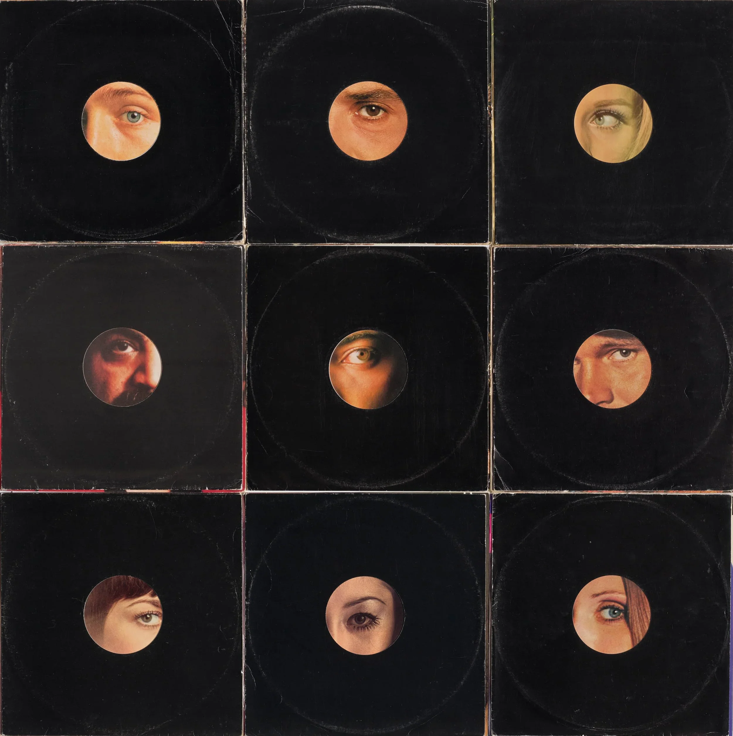 A grid of nine black record covers with circular cutouts, each revealing a close-up of a person's eye.