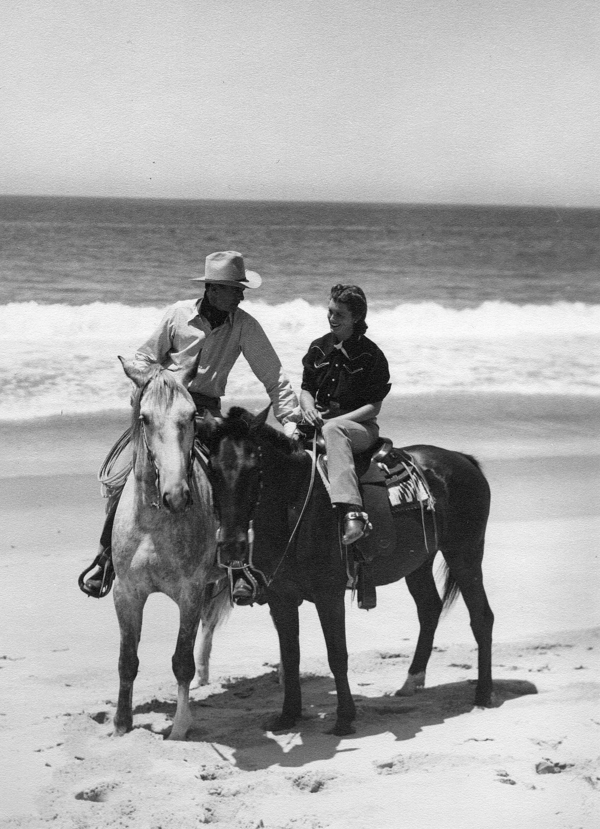 A favorite weekend getaway: riding on the beaches near Malibu. They kept the horses up in the hills and it was a welcome gallop on the sand at the edge of the surf. It looks like my mother was enjoying the special attention of her husband.