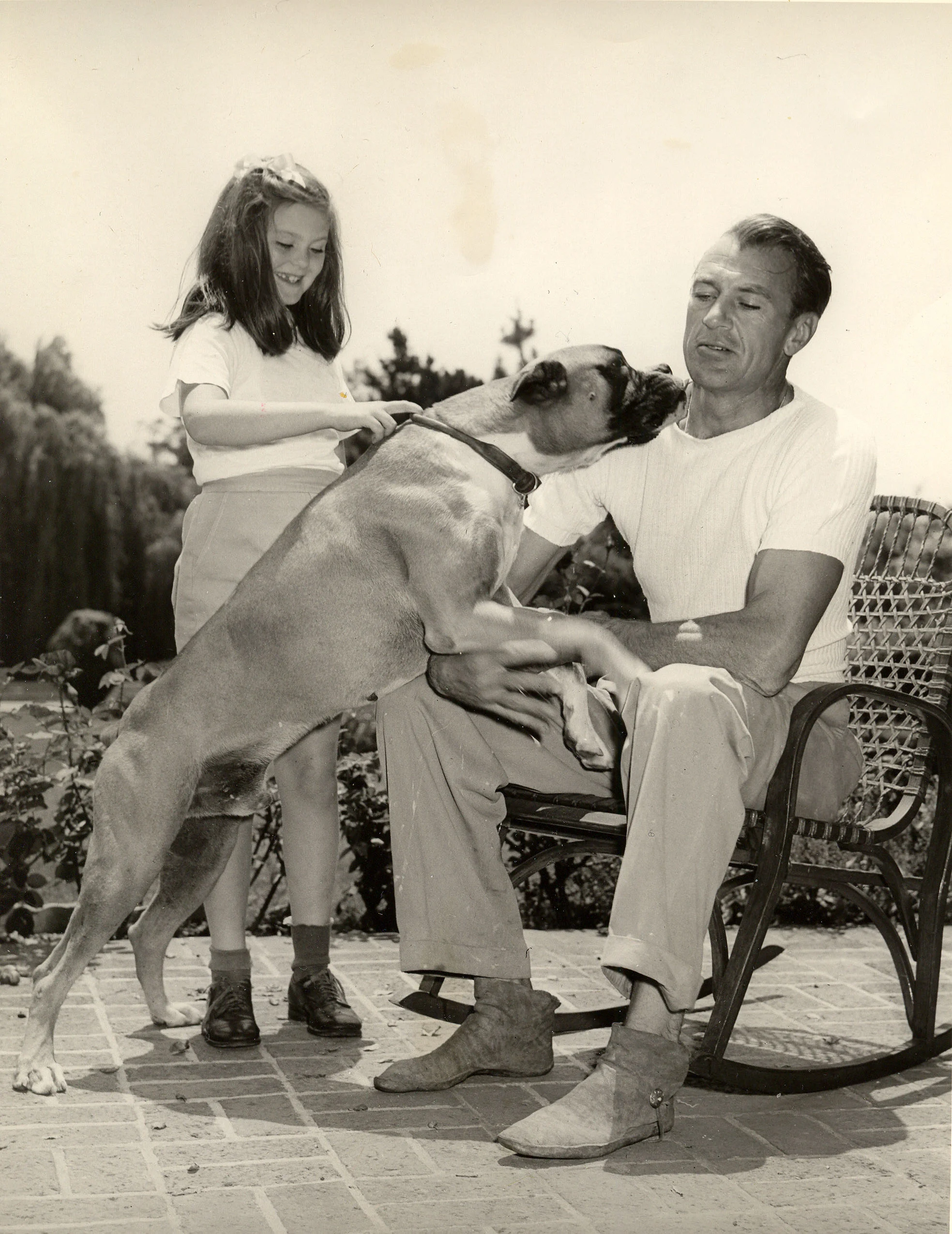 Arno, our beloved boxer, a sweetheart. Notice my father is wearing his favorite shoes - the Indian moccasins he made for himself and for my mother and I.