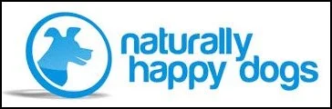 Logo of Naturally Happy Dogs, featuring a stylized dog head silhouette in a blue circle, with the text 'naturally happy dogs' in blue.