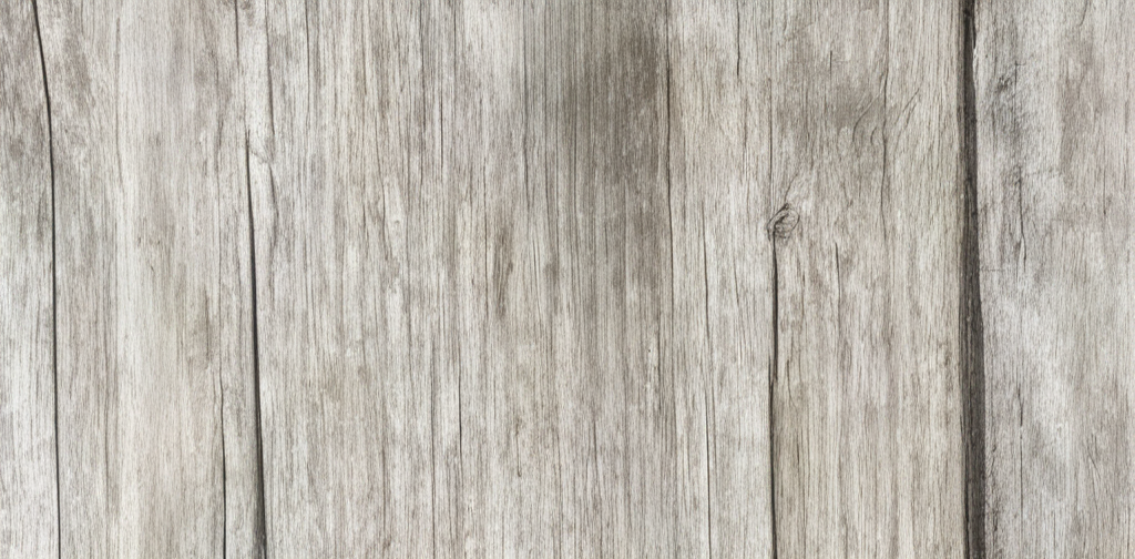 Close-up of weathered wooden planks with visible grain and knots.
