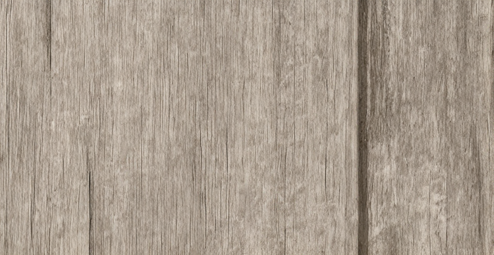 Close-up of a weathered wooden wall with visible grain and texture.