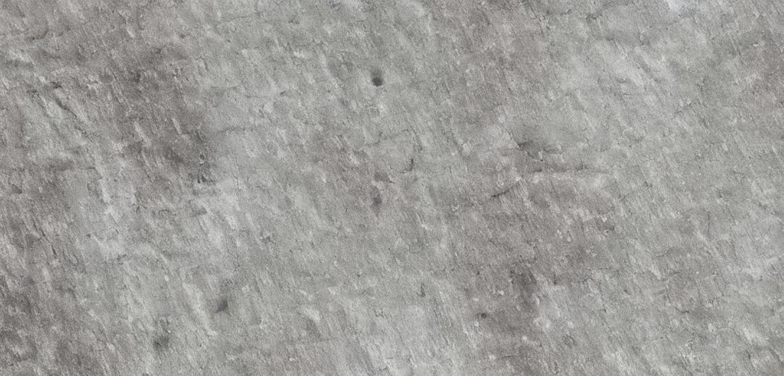 Close-up of a textured gray concrete surface.