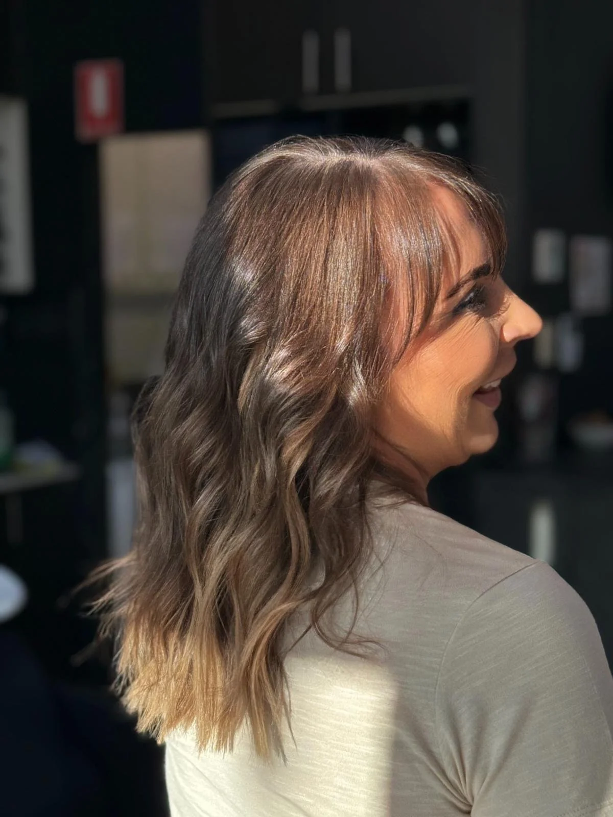 warm brunette with mermaid waves at The Den Hair Salon Chipping Norton