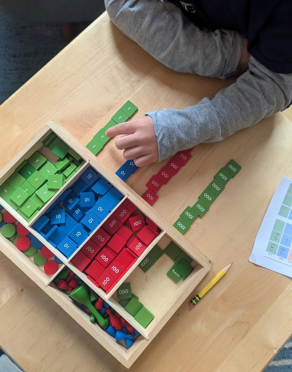 Child using the stamp game material