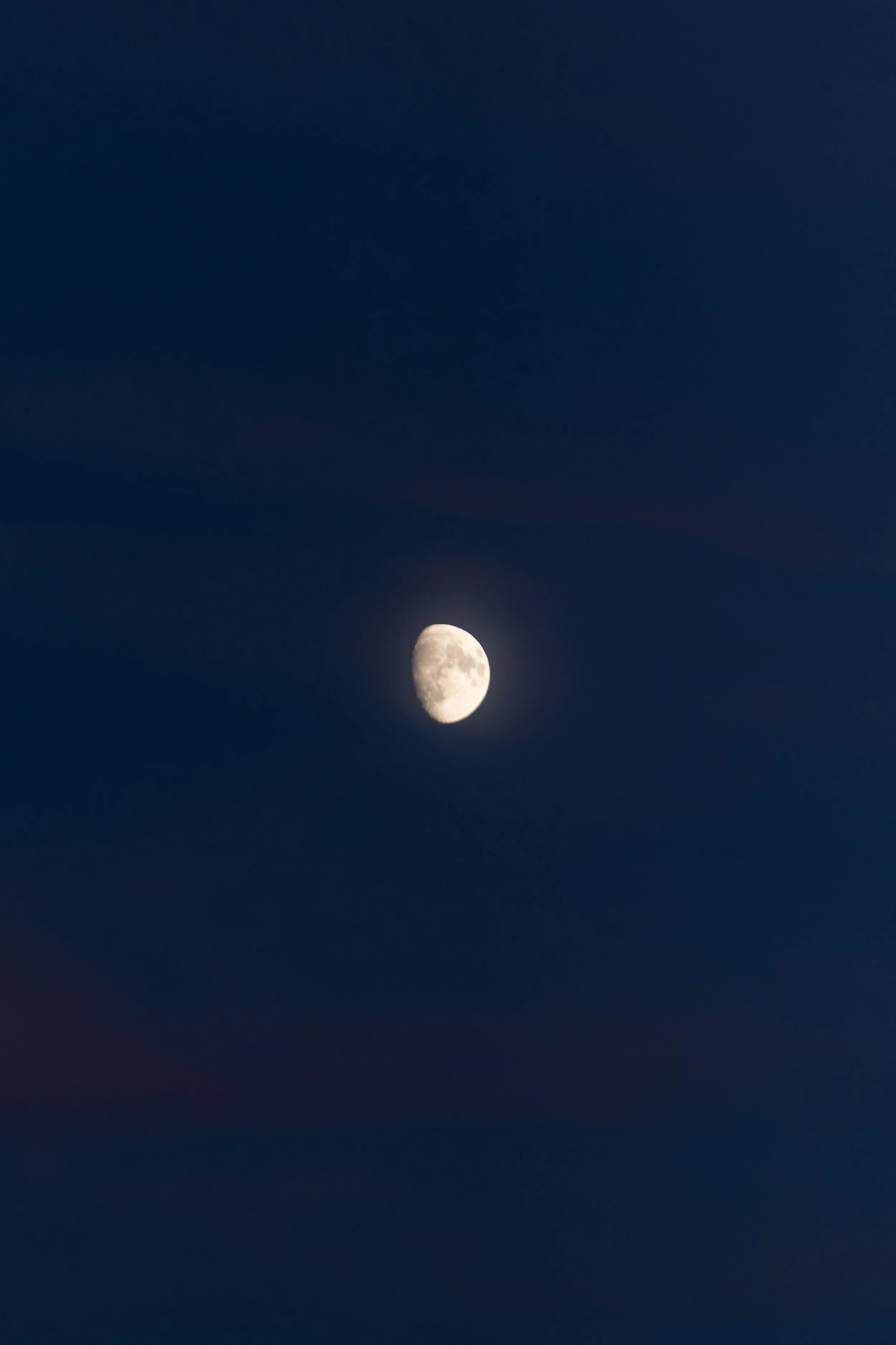 The moon in a dark night sky.