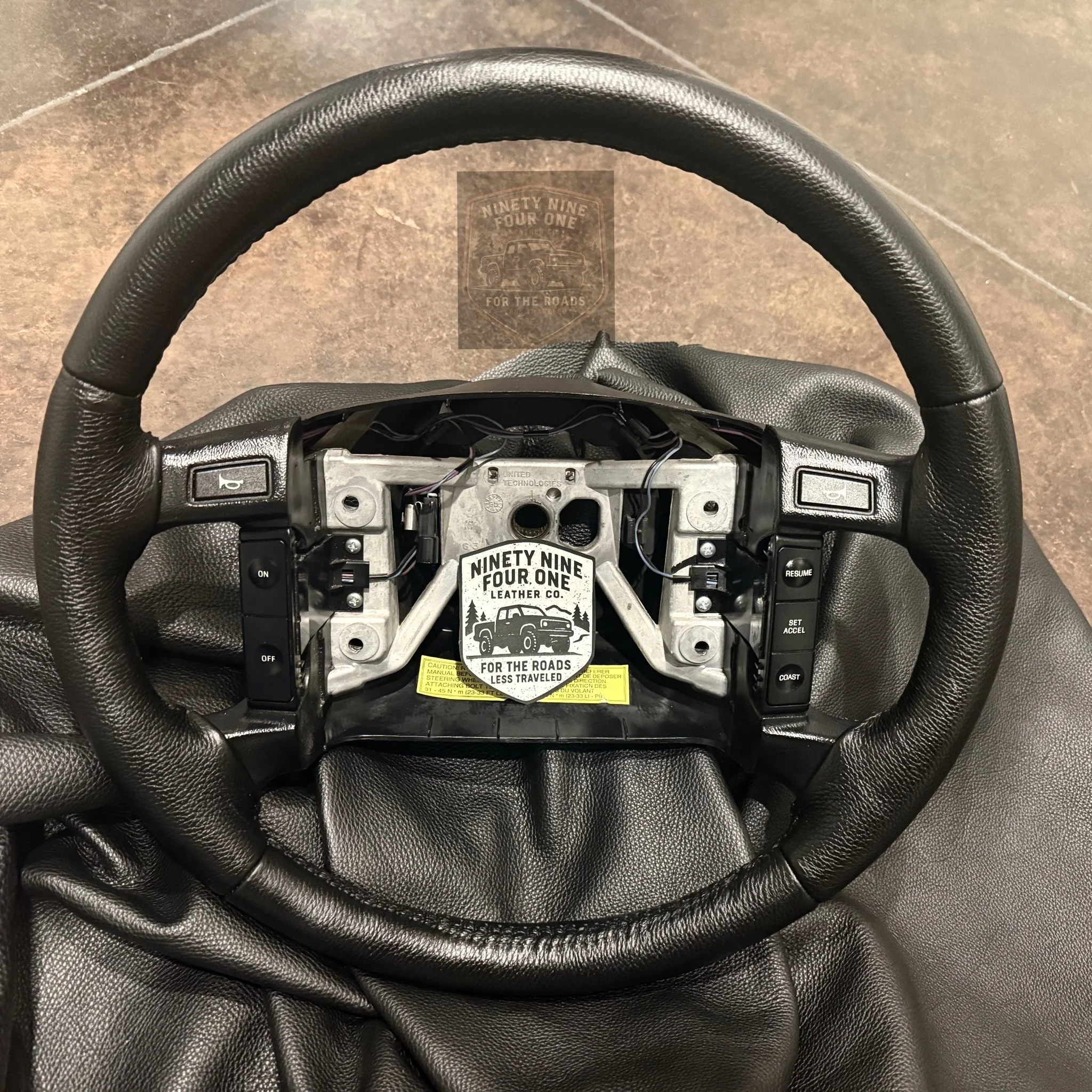 F150/BRONCO AIRBAG STEERING WHEEL RE-COVERED - 4 POST - 1992-1996 FORD F-SERIES & BRONCO