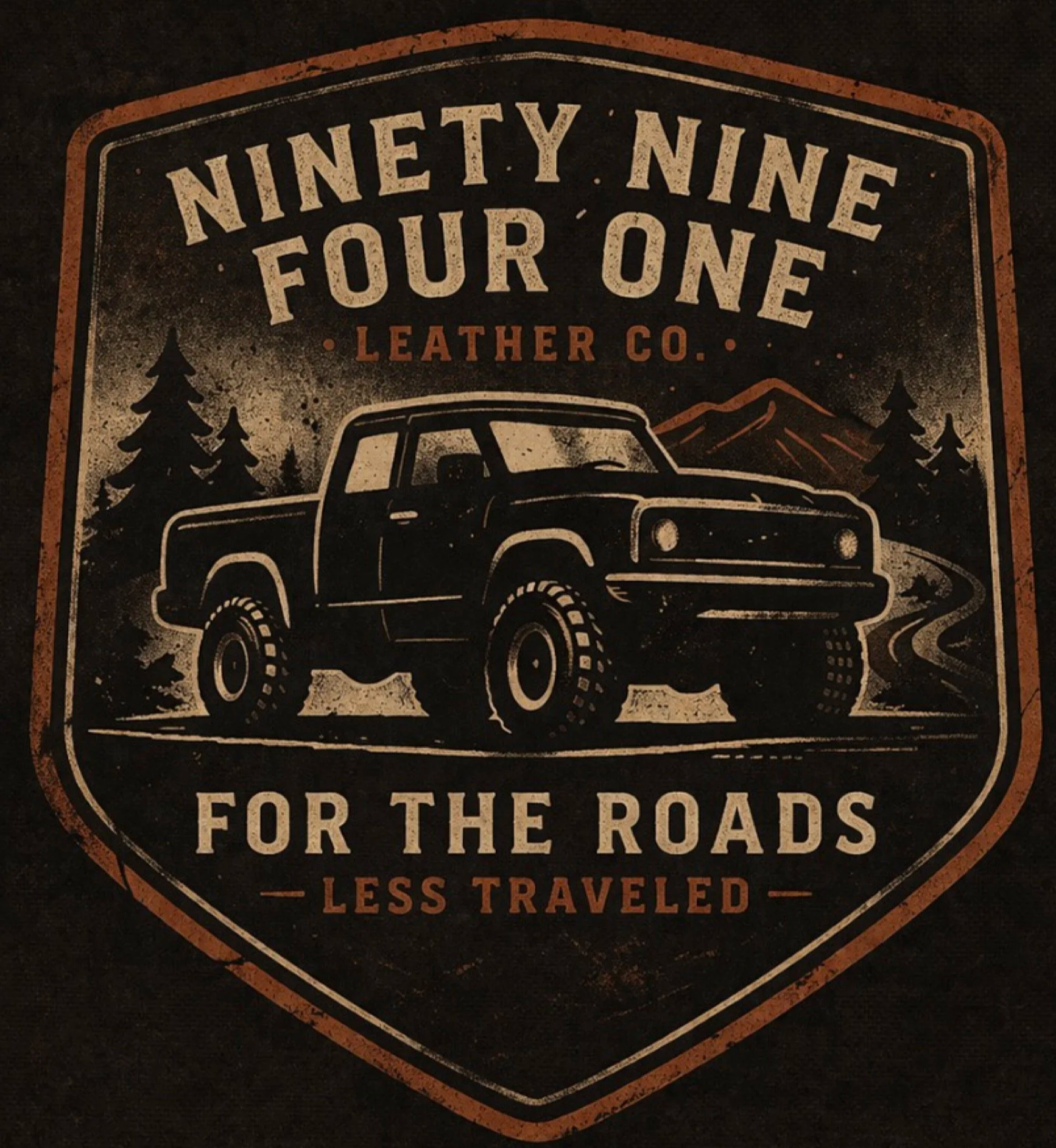 A vintage-style sign with a black background, featuring a truck, pine trees, and mountains. The text reads 'NINETY NINE FOUR ONE LEATHER CO. FOR THE ROADS LESS TRAVELED'.