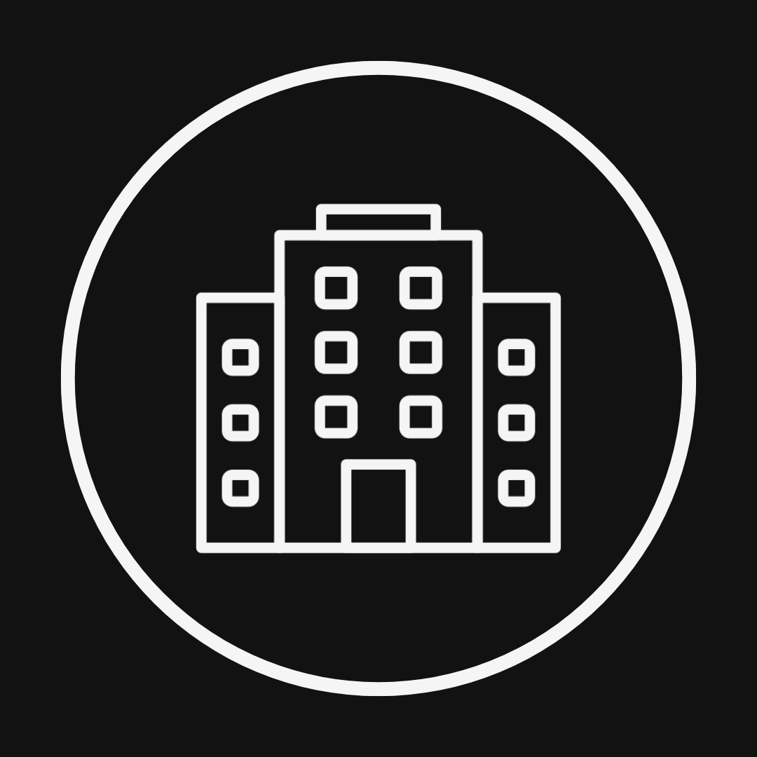 Line drawing of a multi-story building inside a circle with a black background.