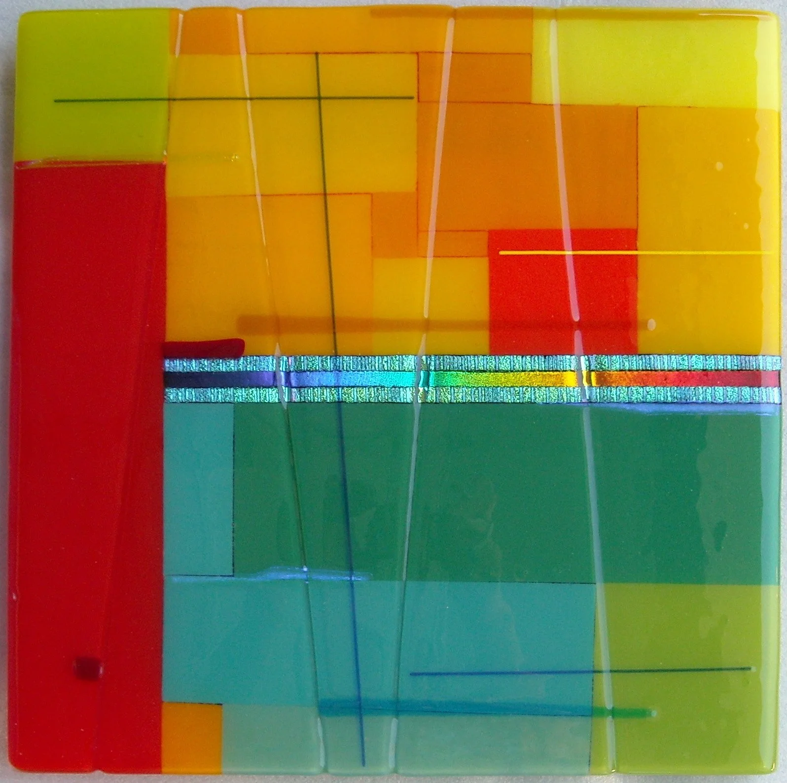 Yolanda Adra Designs.  Opalescent and dichroic fused glass. 16H x 16W. 