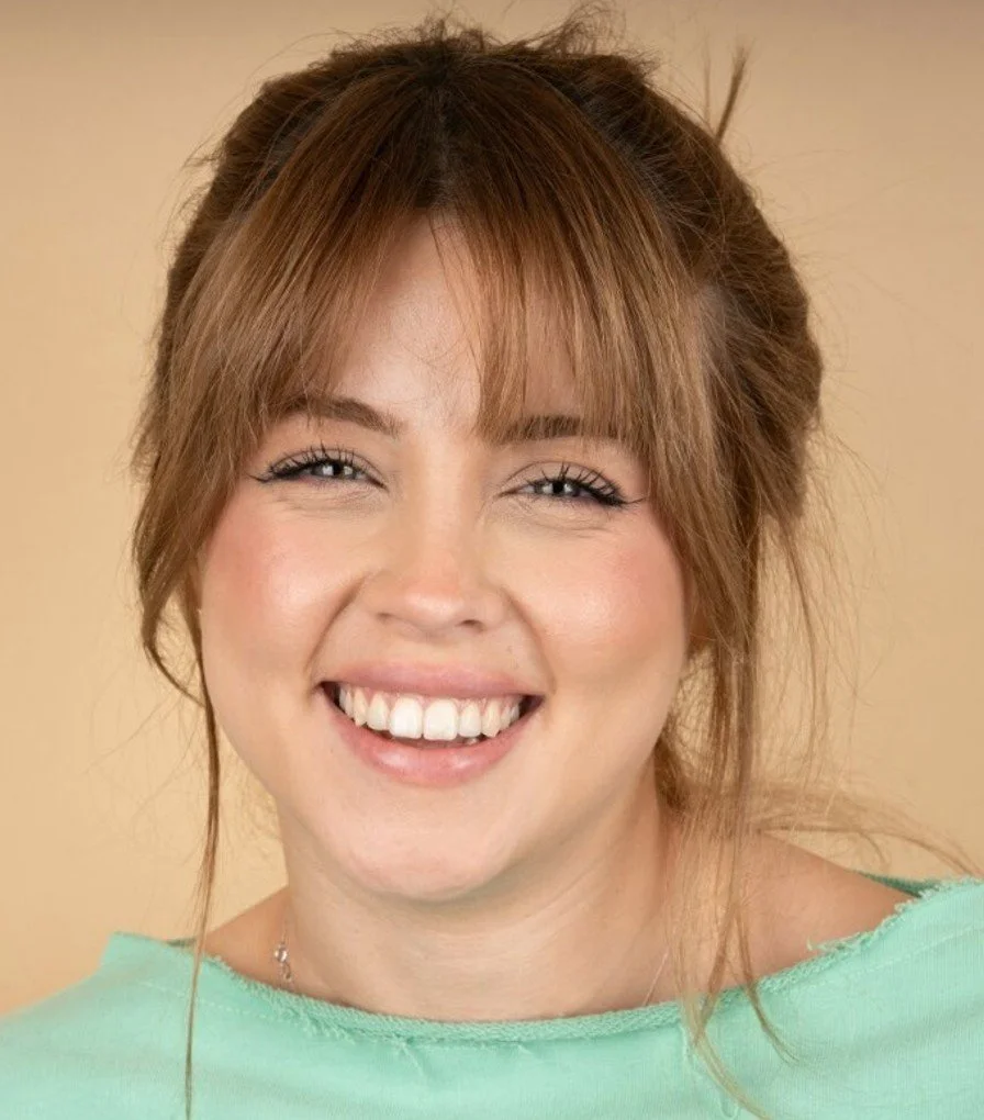 Young woman smiling after straightening her teeth with clear aligners at Accent Your Dentist in Ponsonby, Auckland.