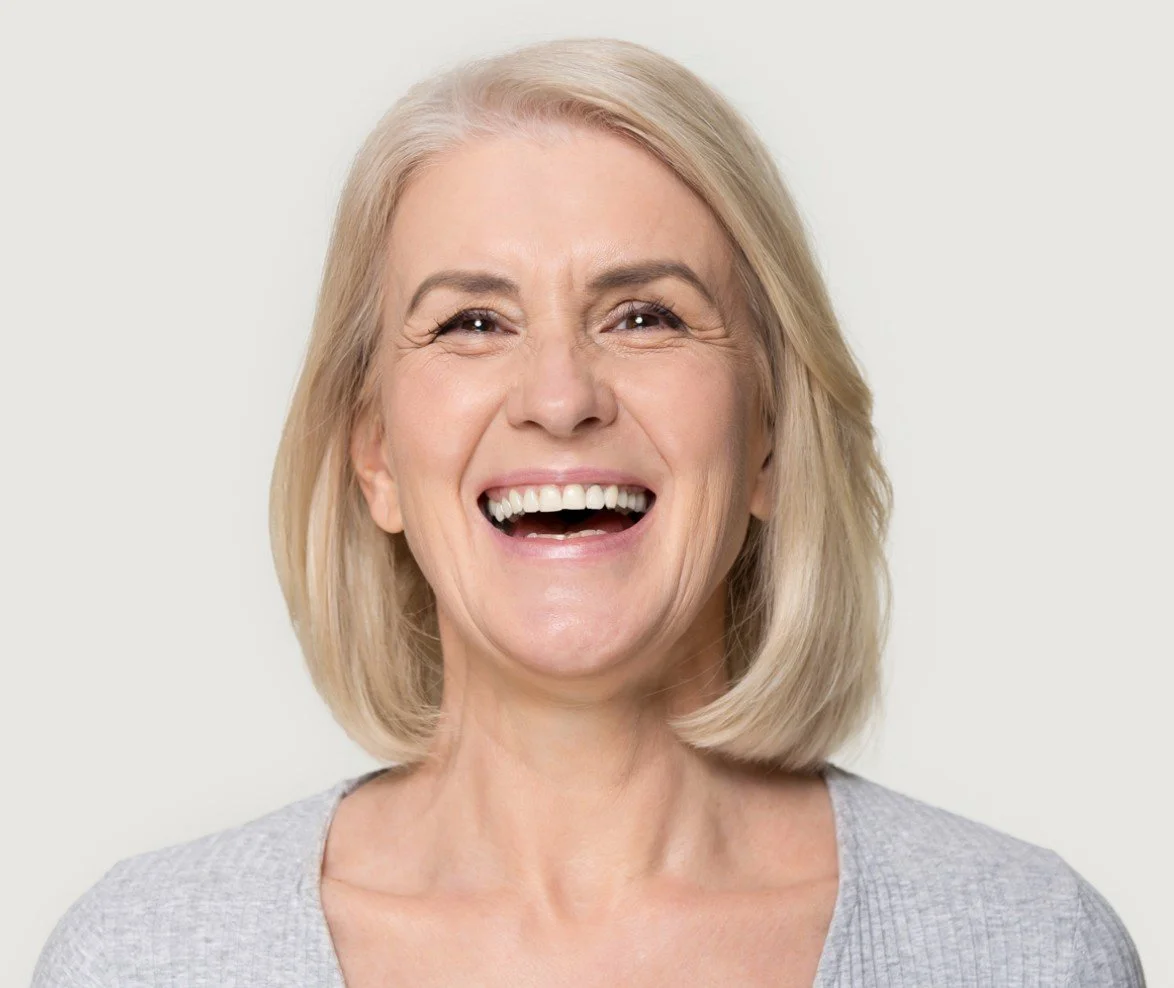 Mature woman smiling naturally after cosmetic Botox treatment at Accent Your Dentist in Ponsonby, Auckland.