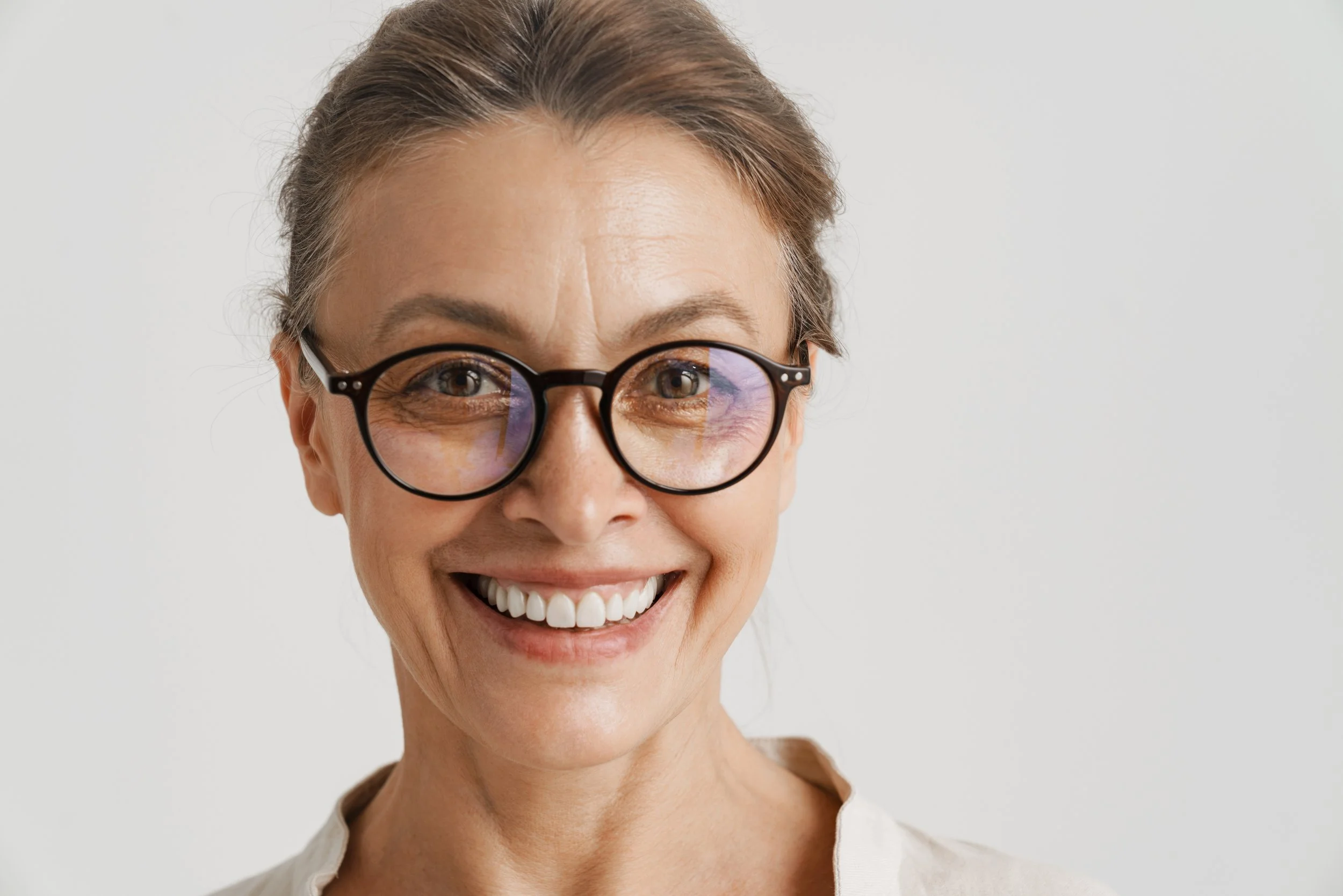Woman smiling confidently after preventive dental care at Accent Dentists