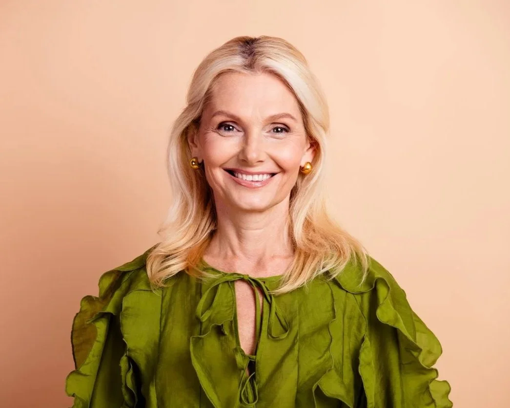 Middle-aged woman enjoying a healthy, confident smile following treatment at Accent Your Dentist.