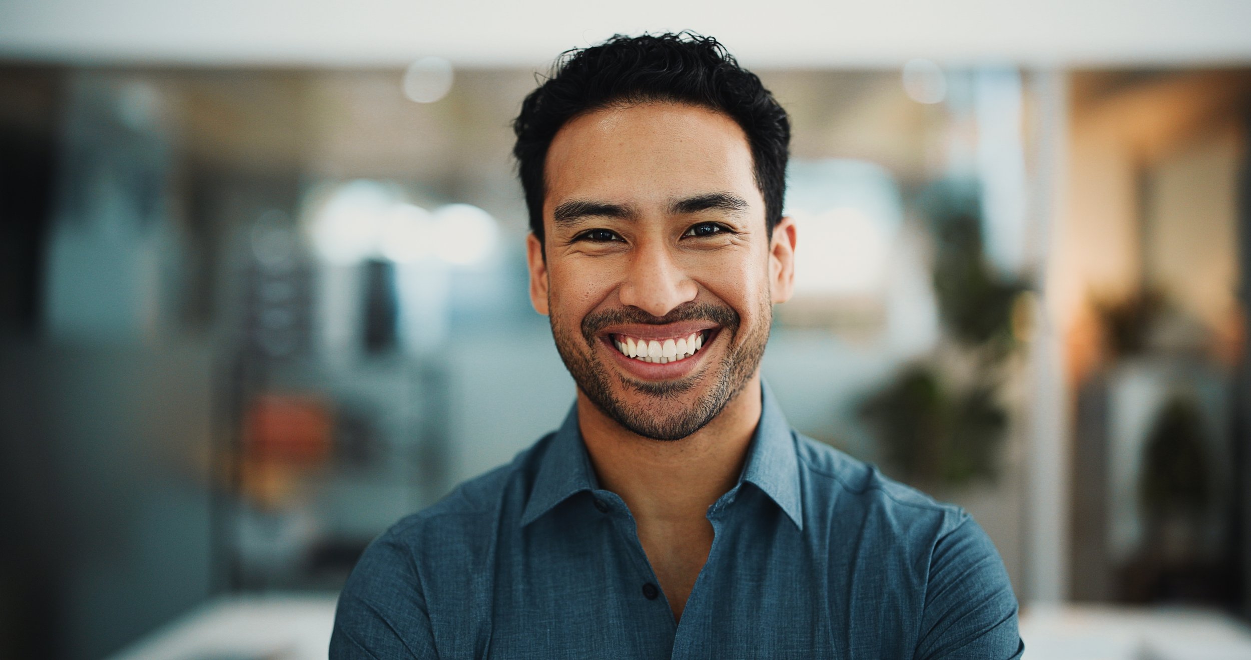 Man smiling with healthy teeth following routine dental maintenance in Ponsonby