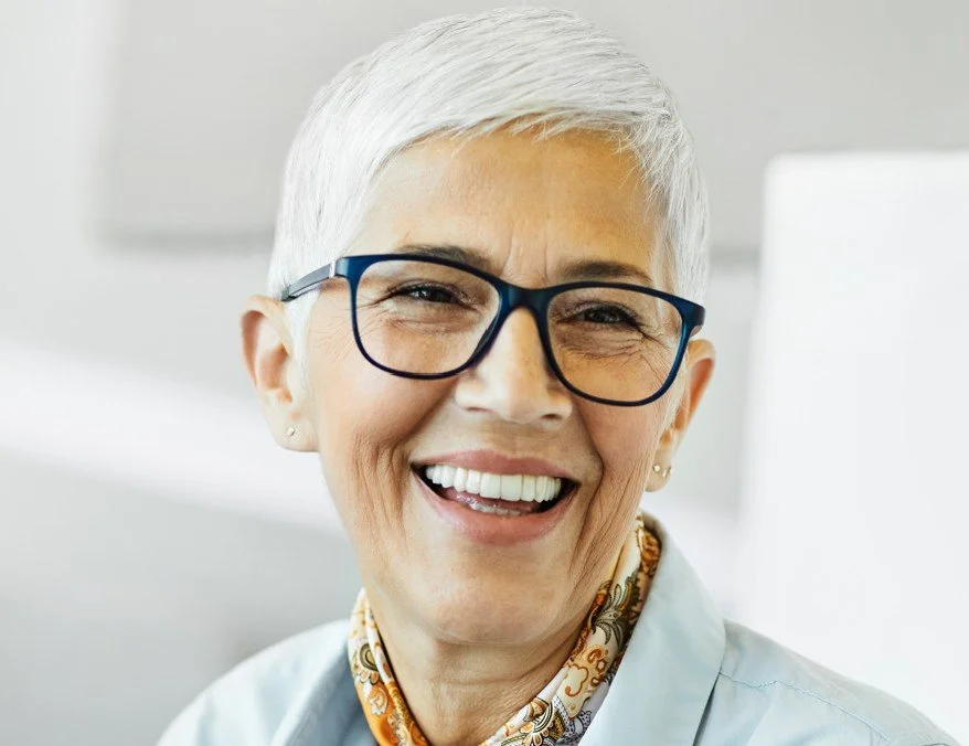 Female patient with a white pixie cut enjoying a healthy smile after preventive dental care at Accent Your Dentist.