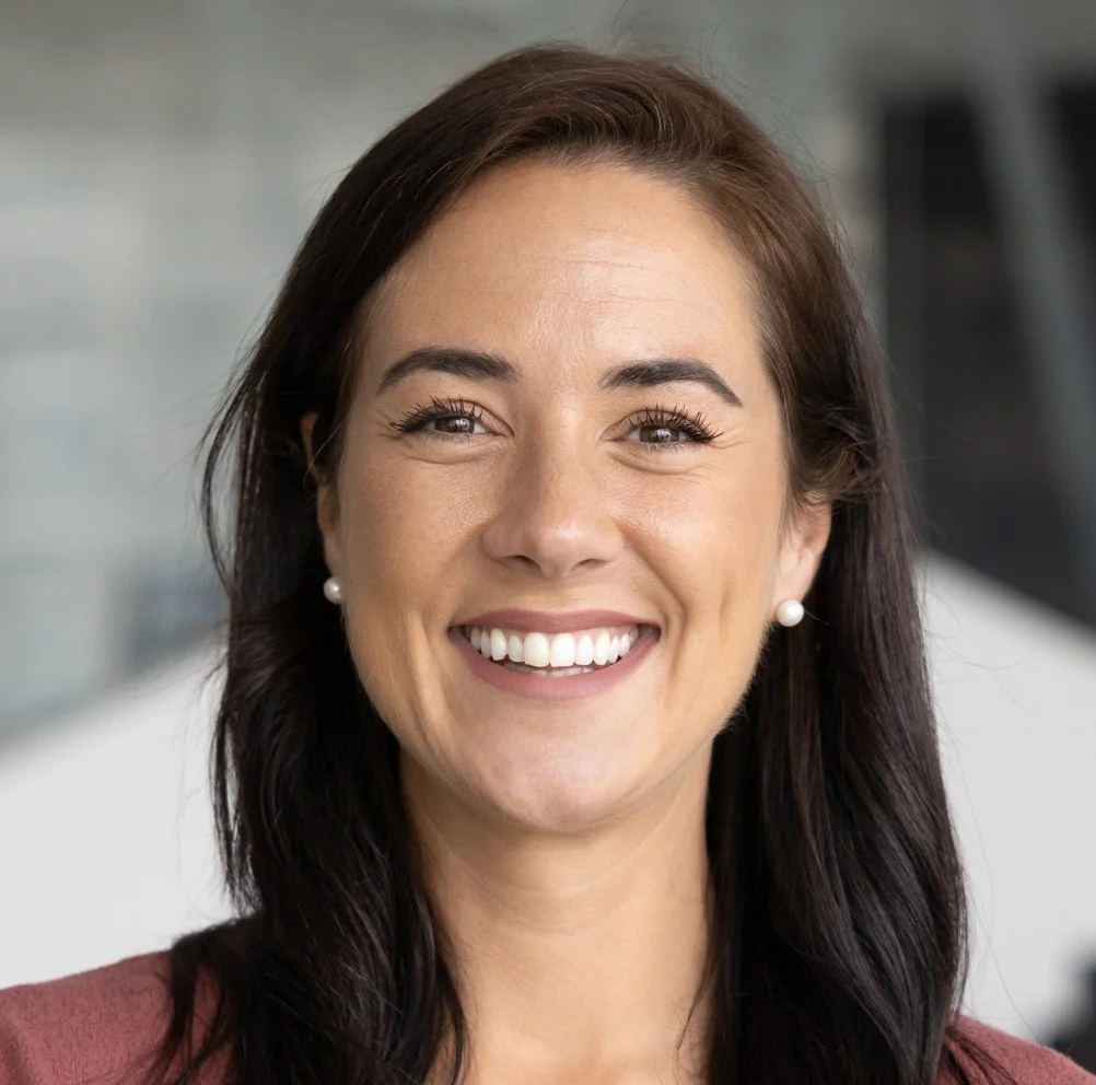 Middle-aged woman smiling after replacing a missing tooth at Accent Your Dentist in Ponsonby, Auckland, restoring her healthy, natural smile.