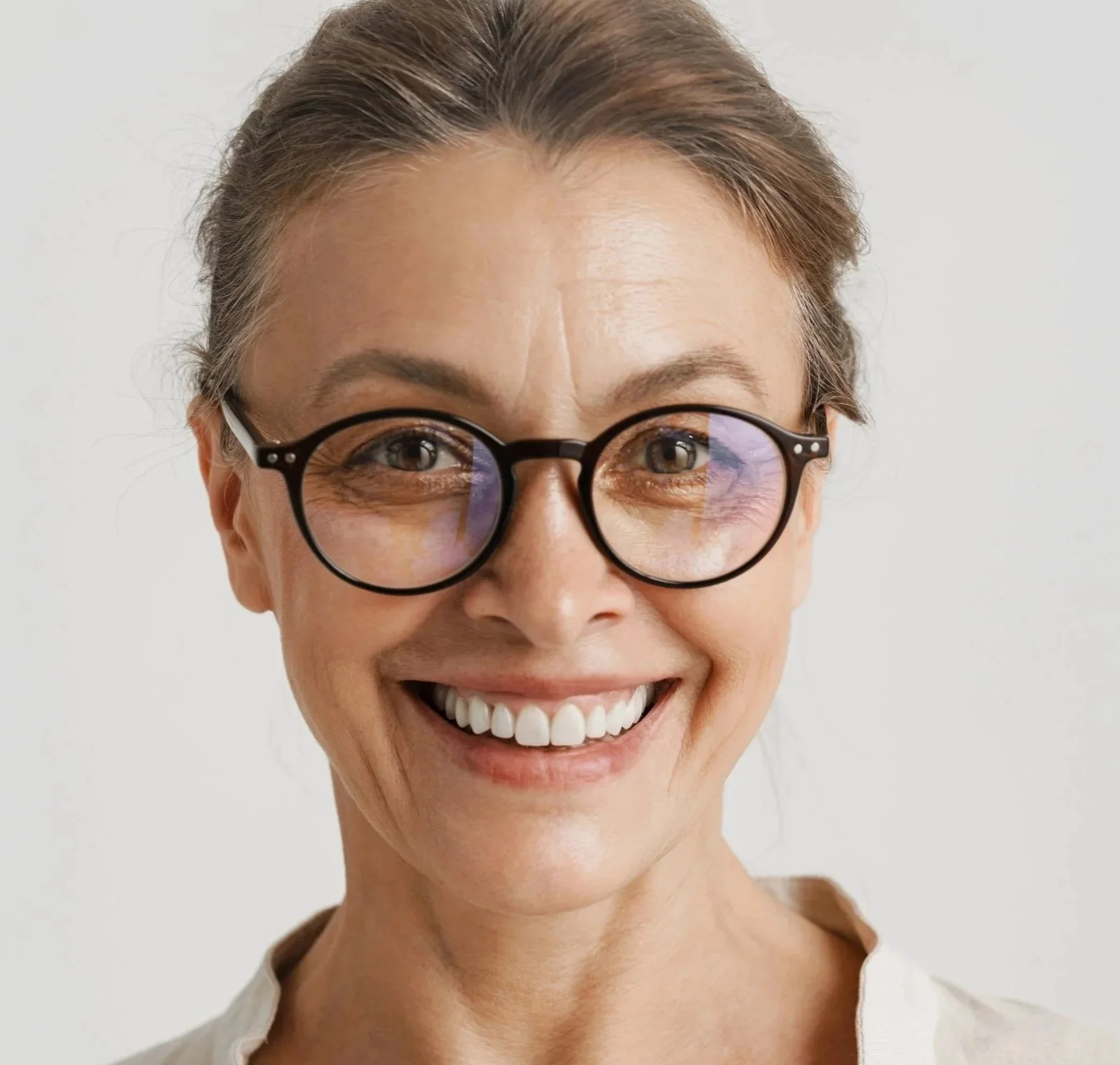 Woman smiling during a consultation about dental treatment costs and payment plans at Accent Your Dentist.