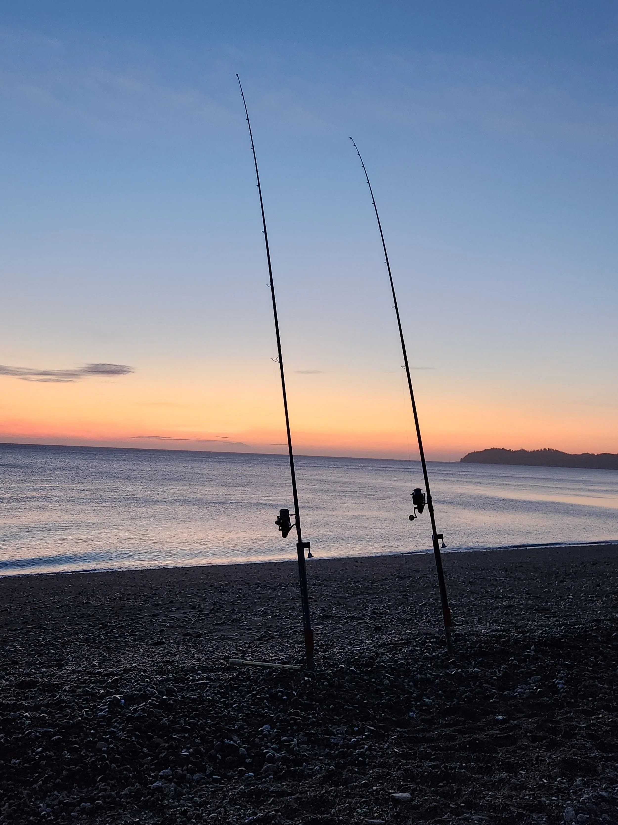 Two fishing rods on a beach on the Kenai Peninsula.