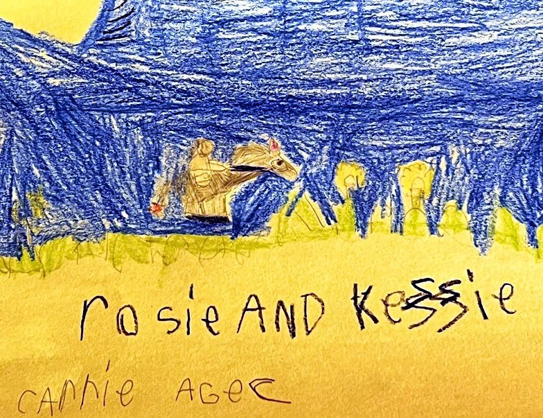 Child's drawing featuring a horse and figures with a blue sky background, and yellow ground with the text "Rosie and Kessle" and "cannie age" written at the bottom.