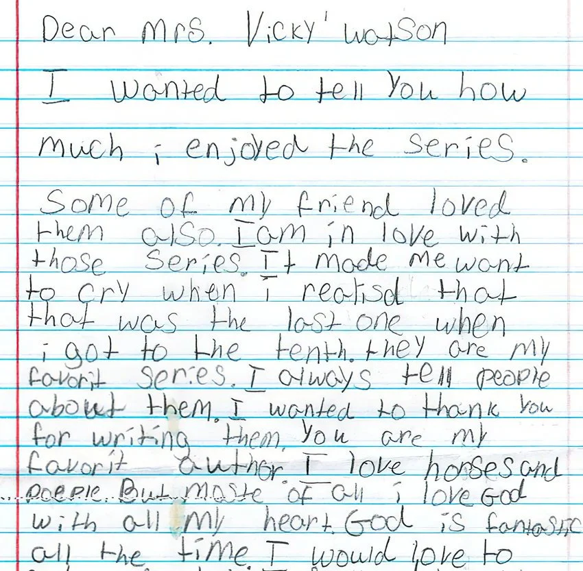 A handwritten letter on lined notebook paper, addressed to Mrs. Vicky Woolson, expressing enjoyment of a series, love for horses, and gratitude for writing the series.