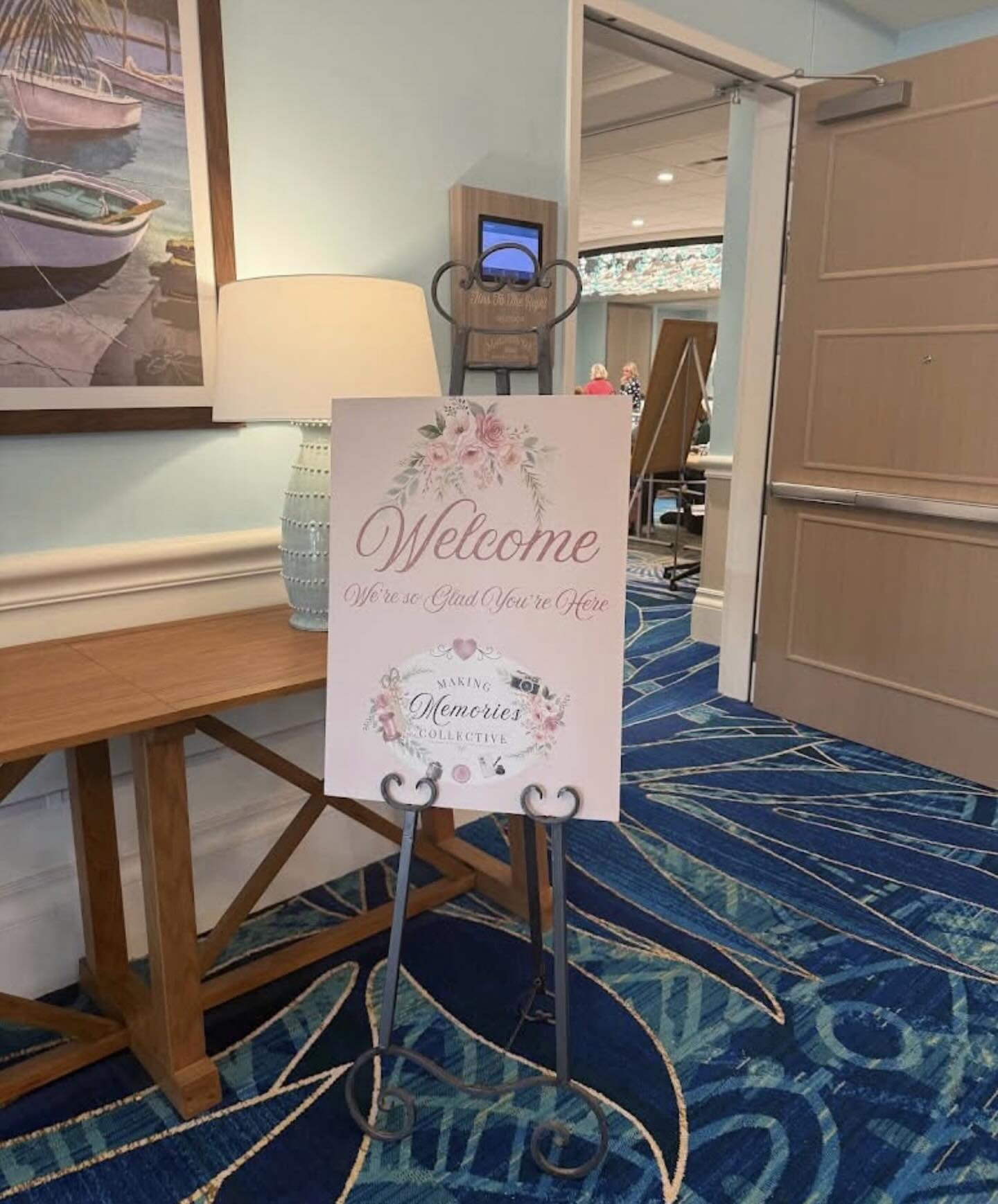 Making Memories Collective welcome sign on an easel outside the retreat room, reading “Welcome, we’re so glad you’re here.”
