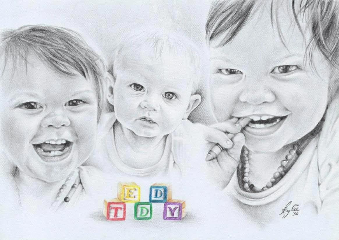 Black and white pencil drawing of three children smiling and playing, with colorful toy blocks spelling 'Teddy' at the bottom.