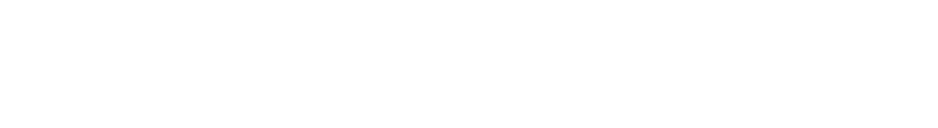 Close-up of a signature written in white ink on a black background.