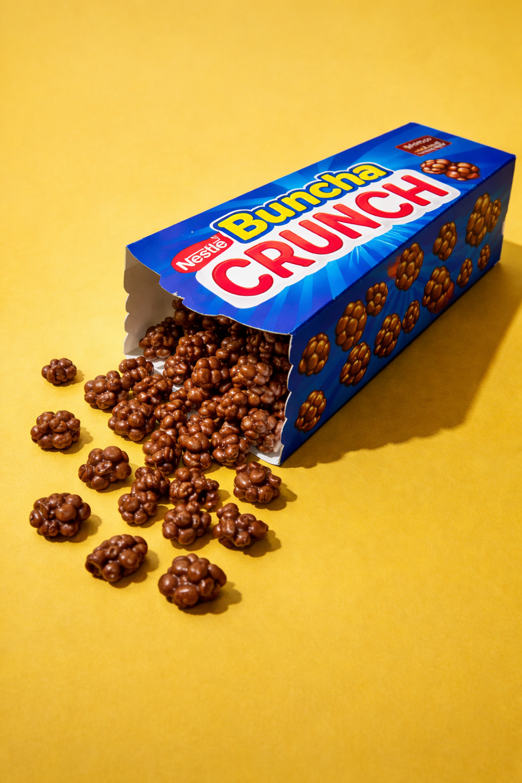 A box of Nestle Buncha Crunch candy that has fallen over